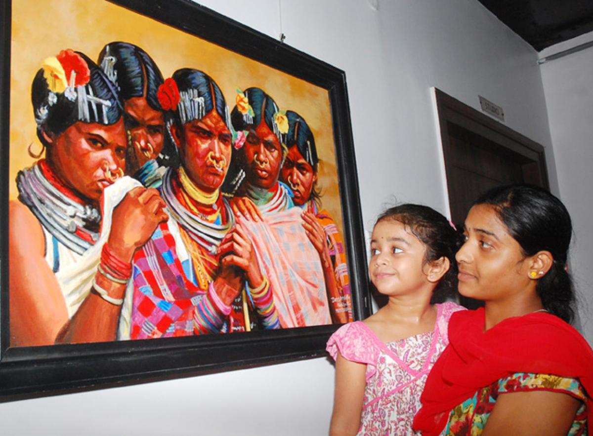 Art lovers going round &lsquo;Godavari Maha Pushkaram - 2015&rsquo; painting exhibition at Aakriti Art Gallery in Vijayawada, on Sunday. Photo: N Kishore